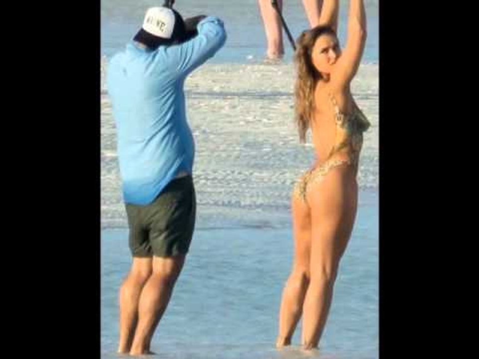Ronda Rousey poses naked in painted-on bathing suit for Sports Illustrated shoot