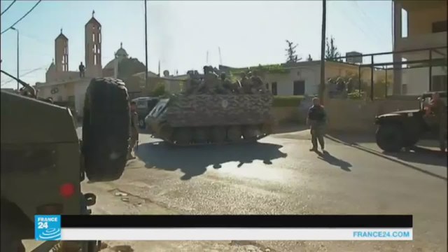 مواطنون يحملون السلاح للدفاع عن بلدة القاع اللبنانية