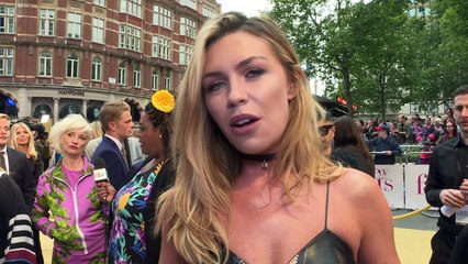 Abbey Clancy has the blues as she lands back in UK