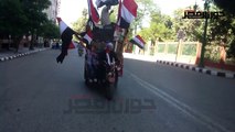 سيارات تجوب شوارع أسيوط تذيع الأغاني الوطنية احتفالا بذكرى 30 يونيو