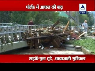 Heavy storms in Poland cause flooding and damage to homes, cars