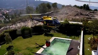Firefighting Helicopter Fills Up At Pool