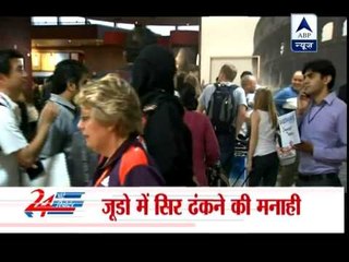 Saudi judo athlete can't wear head scarf in Olympic competition‎