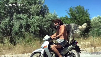 Man takes his dog for a ride on his motorcycle