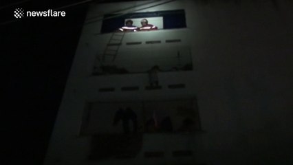 Firefighters rescue boy stuck on a balcony