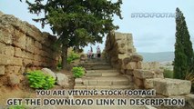 Group of tourists walking upstairs, sightseeing tour to ruins of ancient building. Stock Footage