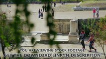 Many tourists go sightseeing around ruins of ancient building, summer vacation. Stock Footage