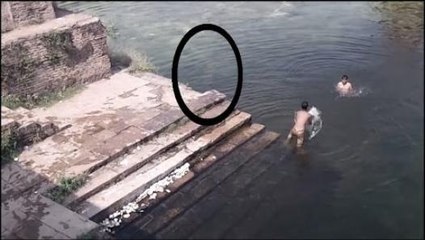 Ghost caught on Camera jumping in POND!