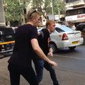 2 Foreigners In Bollywood in Mumbai, India, crossing Road
