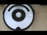 Roomba IRobot 560 goes for a charge docking back after cleaning around
