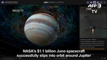 NASA celebrates as spacecraft slips into orbit around Jupiter