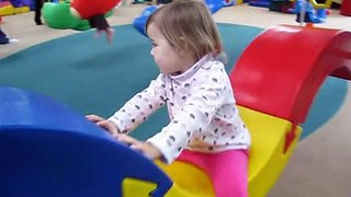 Riding the big swing at My Gym ~ 23 months old