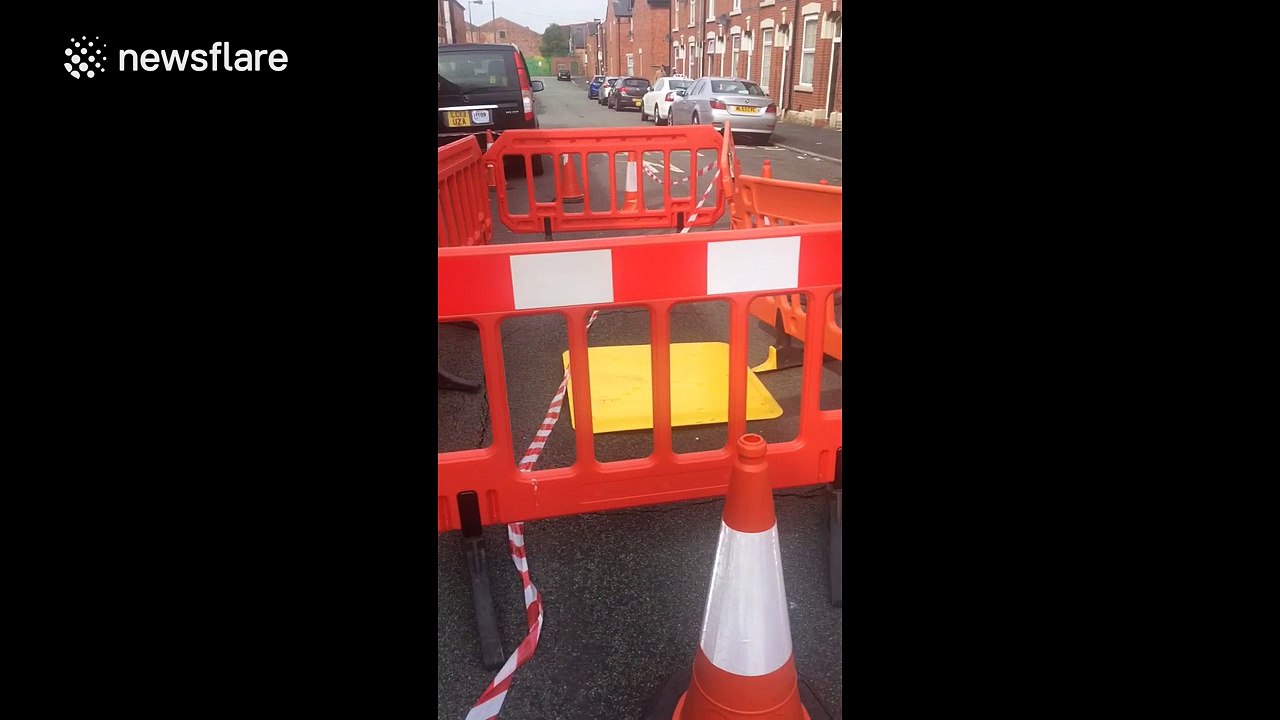 Minor sinkhole appears on road near Manchester, UK