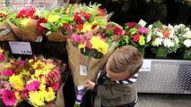 Seven-year-old boy with dwarfism exchanges flowers for smiles