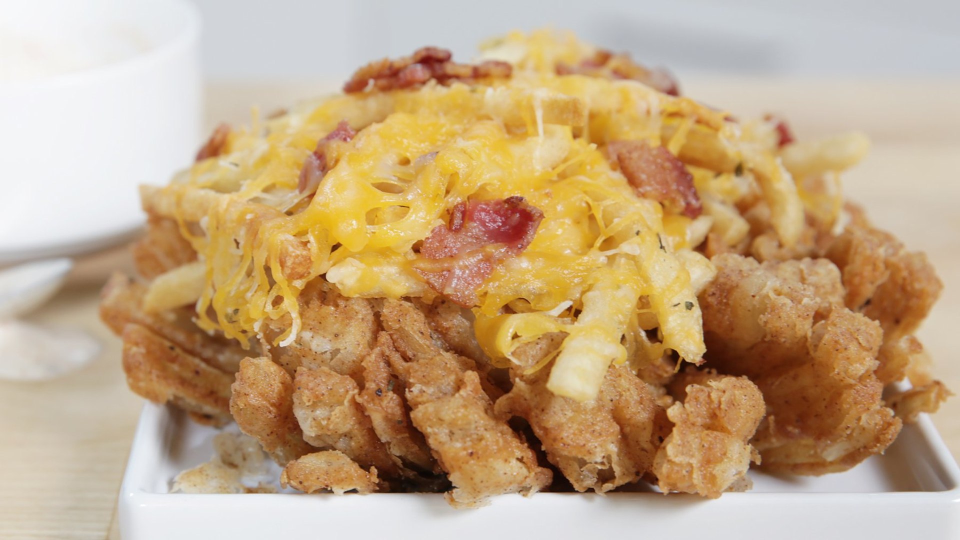 Hacking Outback S Blooming Onion Topped With Bacon Cheese Fries Video Dailymotion