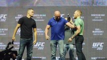 Conor McGregor and Nate Diaz square off after the UFC 202 press conference