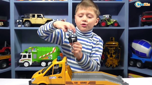 BRUDER Tow Truck with two off-road Land Rover - Playing with BRUDER toys - Video for children