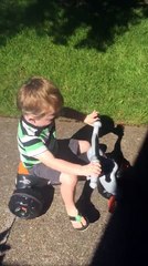 German Shepherd instinctively herds toddler on bike