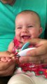 Baby finds mom's hiccups hysterical