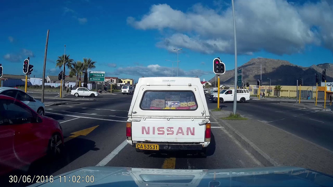 Two Thieves Steal from a Car at Stop Light