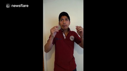 Magician pulls thread out of his eye