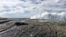 Stunning footage of waves crashing into rocks in slow motion