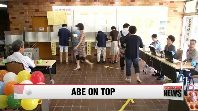 Japan's ruling bloc reach PM Abe's ambitious goal in national election