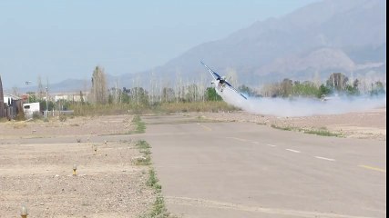 Stunt plane pulls off flawless low pass