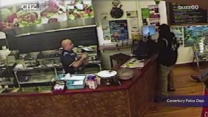 Restaurant Worker Calmly Ignores Armed Robber and Serves a Customer