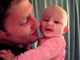 Cute Baby Gets Kisses From Her Dad