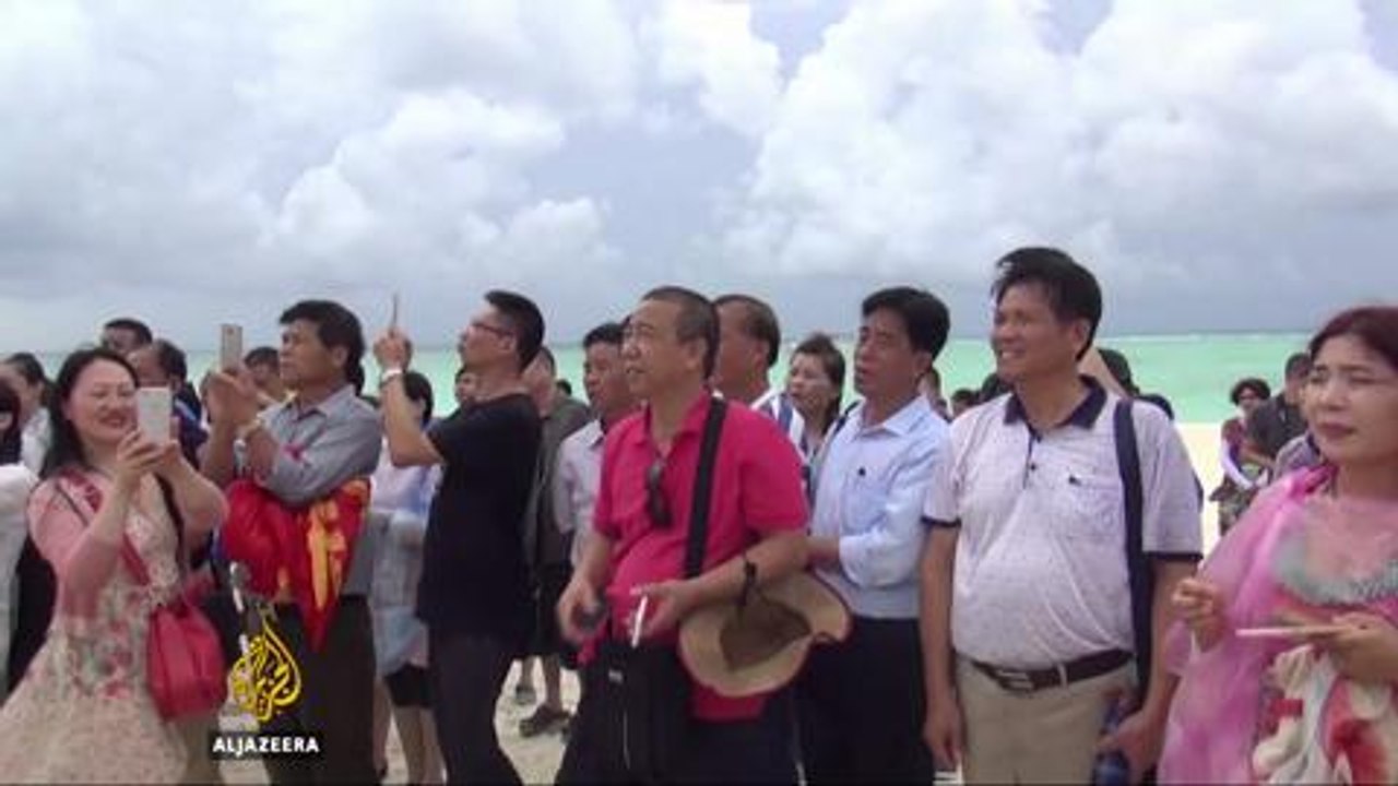 Tourists taken to disputed South China Sea islands