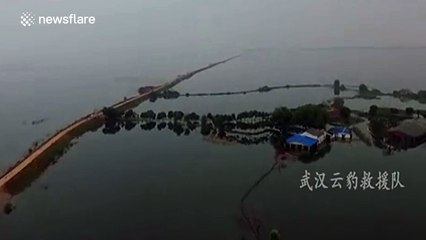 Chinese dam blown up to release floodwater