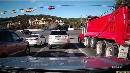 Dump truck barrels through red light, smashes cars
