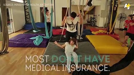 A trainer teaches disable people acrobatics