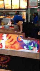 Popeye's: lady rolls over the counter and starts throwing chicken around