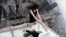 Terrifying video of pair performing stunts at the top of skyscraper