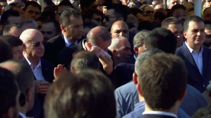 Turkish president breaks down in tears at mass funeral