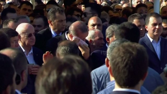 Turkish president breaks down in tears at mass funeral