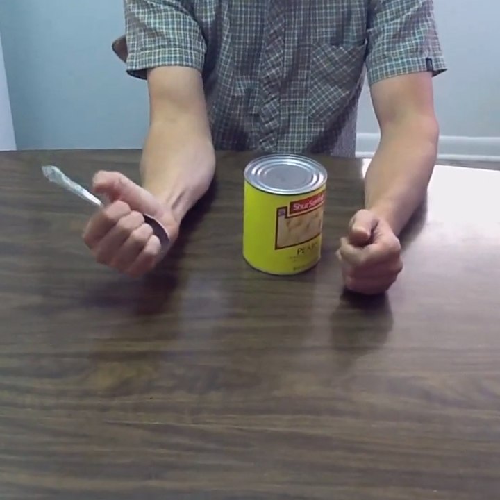A simple spoon for opening a tin