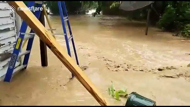Gushing floodwater engulfs West Virginia homes, USA
