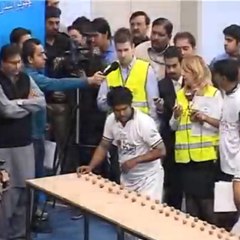 Record: cracking open 155 nuts with his head in one minute