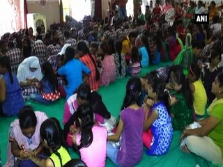 Communal harmony Muslim girls apply henna on Hindu girls  hands on Gauri Vrat