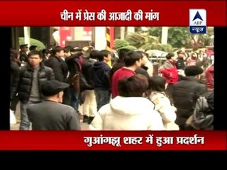 Protesters gather to call on the authorities to loose their censorship on the press in China