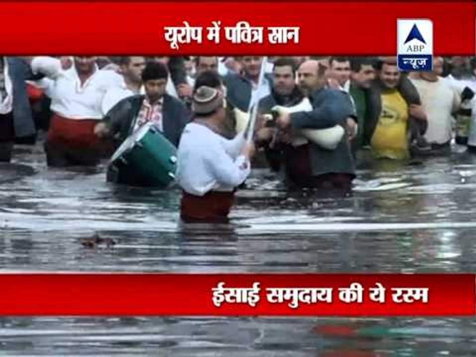 Thousands of Christians leap into icy rivers and lakes to commemorate baptism of Jesus