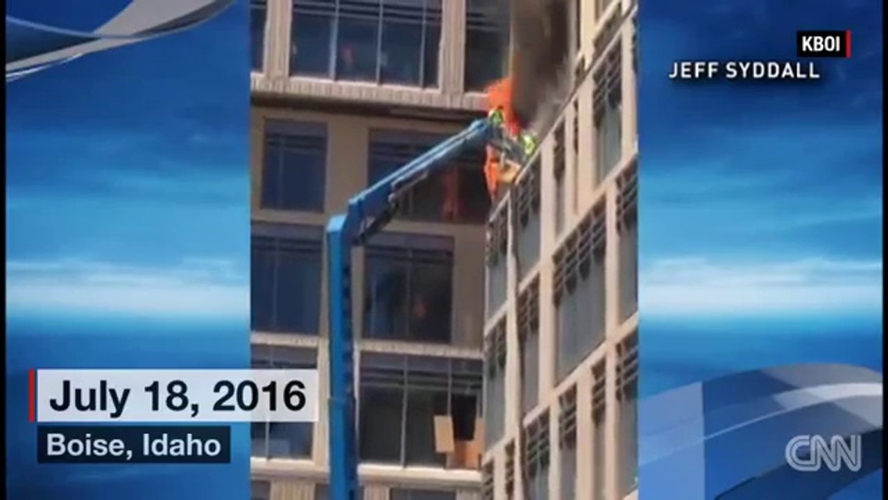 Construction workers jump from burning lift