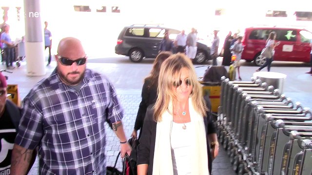 Paparazzi trip over as they photograph Jennifer Aniston at LAX airport