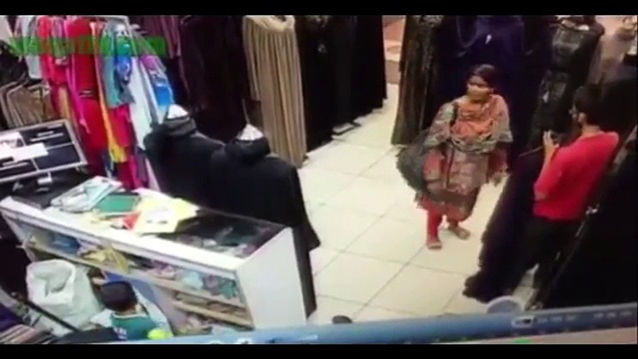 A Little Kid Caught In CCTV Camera Stealing Cash From a Shop With Help Of His Mother