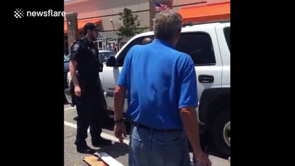 Police open locked car to rescue puppy on a hot day