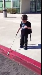 4 yr old Gavin using his white cane to navigate down a curb independently.