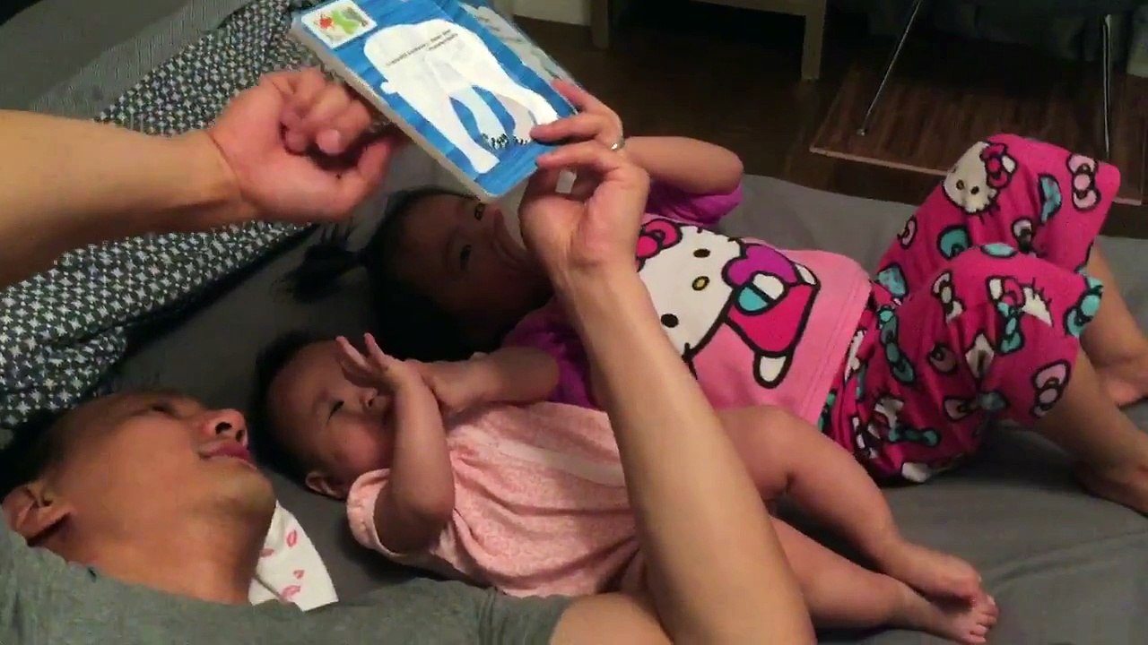 Daddy reading to Ava and Fiona (25 wks / 2 yrs)